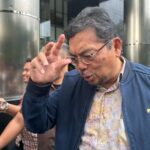 Mantan Direktur LPEI Hadiyanto usai menjalani pemeriksaan di Gedung Merah Putih KPK, Jakarta, Kamis (10/4/2025). (ANTARA/Rio Feisal)