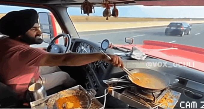 sopir truk masak sambil nyetir