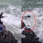 2 Pemancing terseret ombak